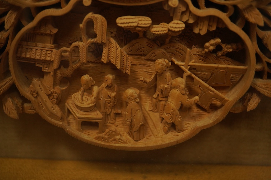 A pair of early 20th century, finely carved Chinese sandalwood photo frames, 30.5cmx24cm oval. Condition - good